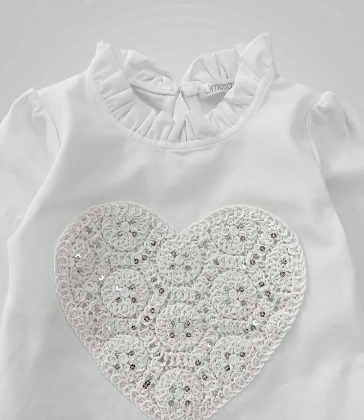 Polera bebé con corazón en macramé