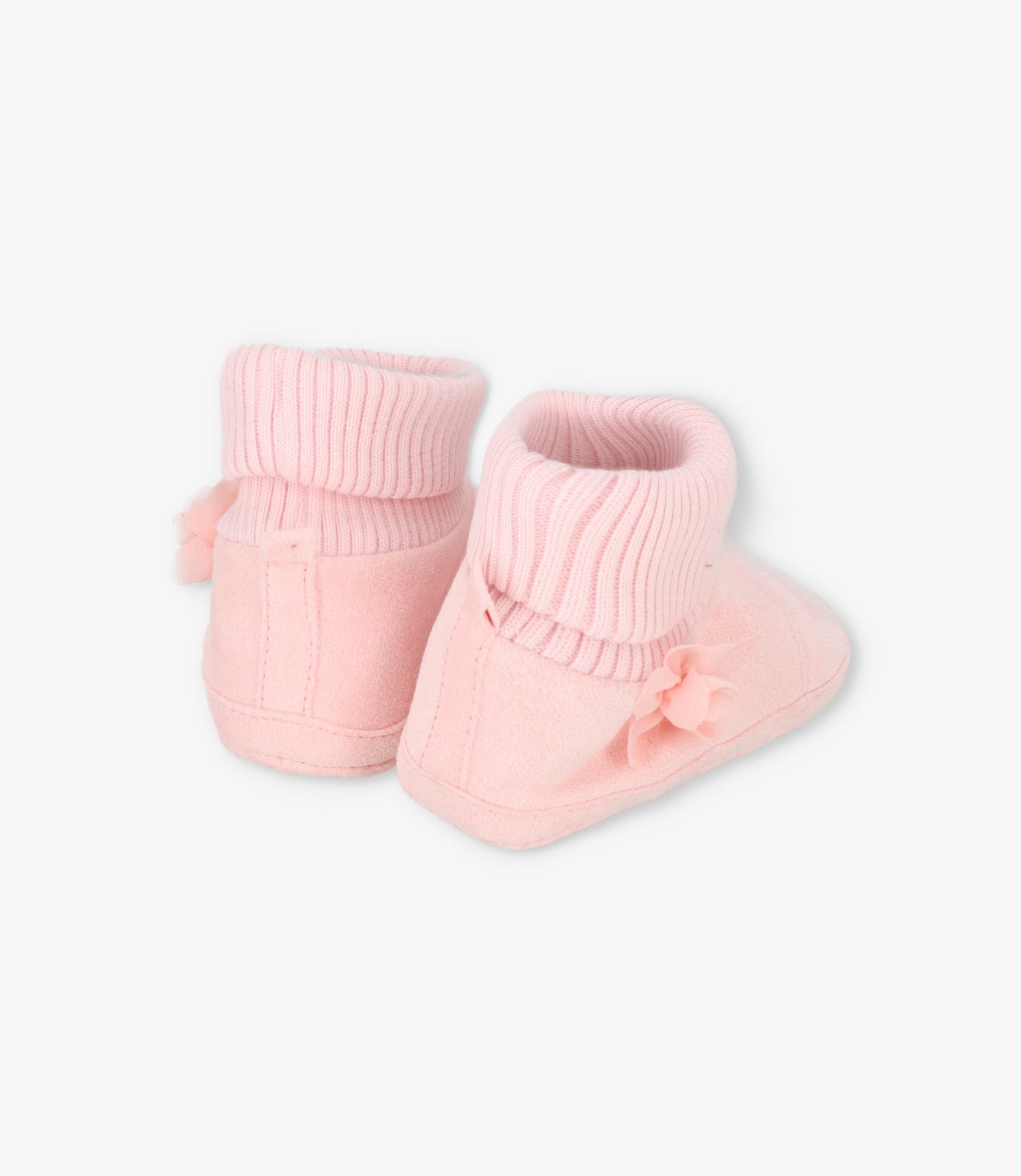 Pantuflas recién nacida con flor