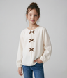 Polera niña con lazos
