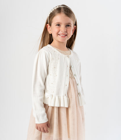 Chaleco niña con lazos y vuelos