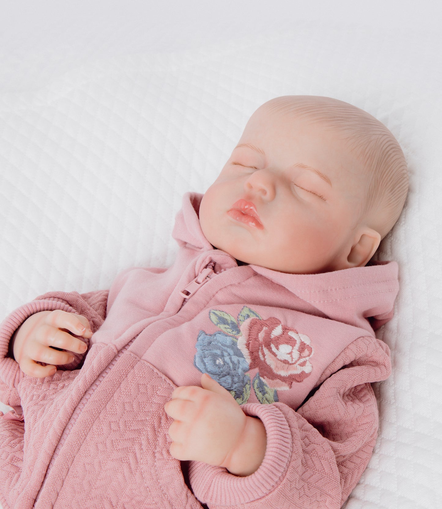 Muñeca baby reborn flores