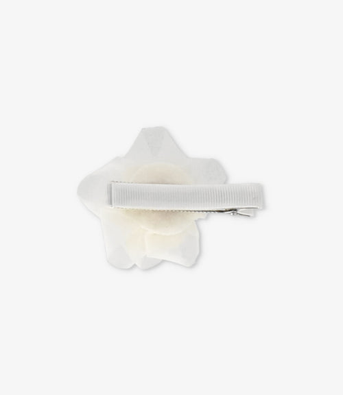 Pinche niña con flor