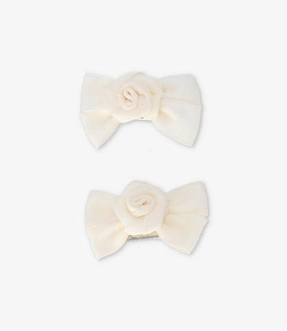 Pinche recién nacida con lazo y flor