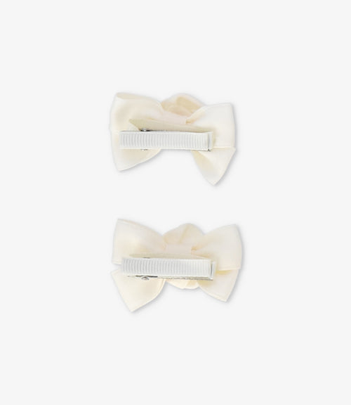 Pinche recién nacida con lazo y flor