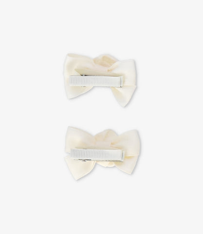 Pinche recién nacida con lazo y flor